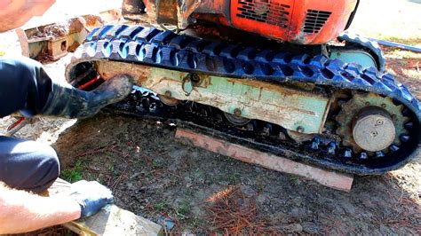 how to change a track on a mini excavator|installing tracks on mini digger.